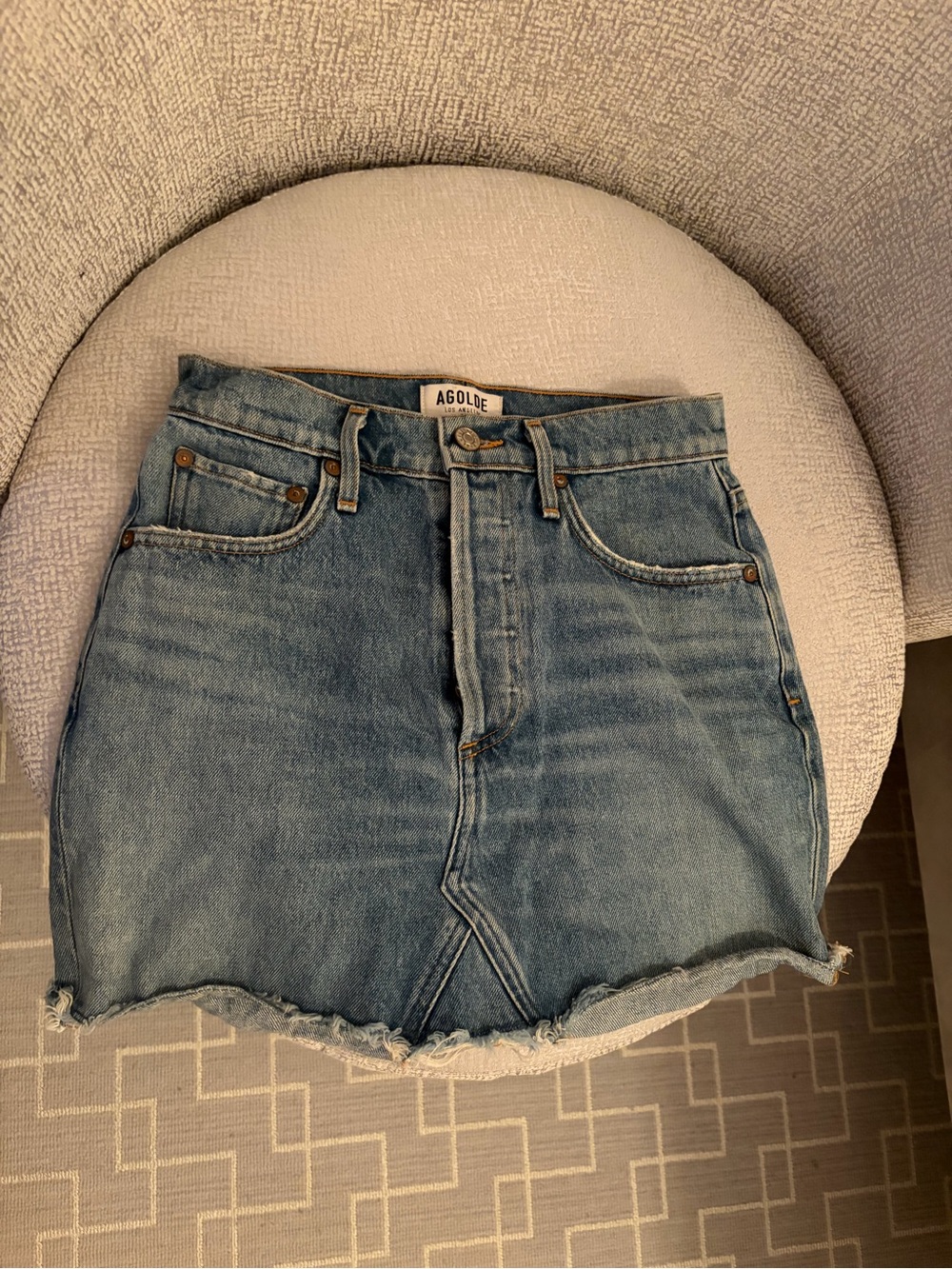 Agolde Medium Wash Denim Mini Skirt with Frayed Hem